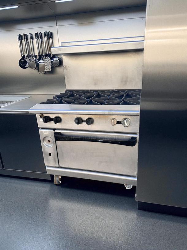 Vulcan V36 36" gas range with 6 open burners, standard oven. Natural gas, superb condition, fully tested.