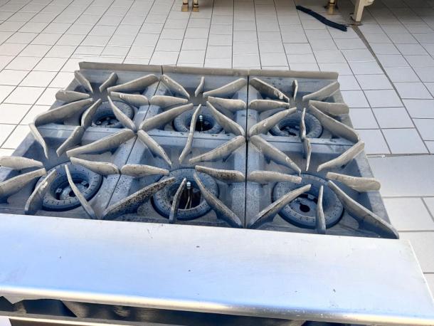 Vulcan V36 gas range with 6 open burners and standard oven. Natural gas, superb condition, stainless steel finish.