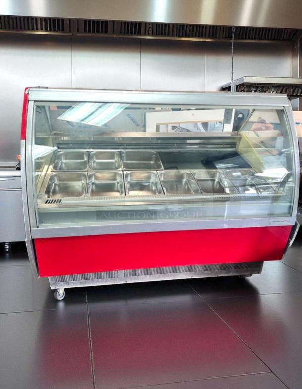 64" refrigerated gelato display case with curved glass and pans. Great condition, fully tested, cooling efficiently.