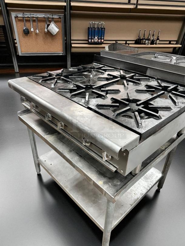Imperial 24" countertop gas range, model IR-4-C, with 4 open burners, heavy-duty cast iron grates, in excellent condition.