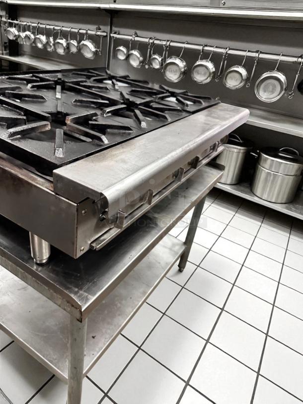 Imperial 24" countertop gas range, model IR-4-C, with 4 open burners, heavy-duty cast iron, excellent condition.