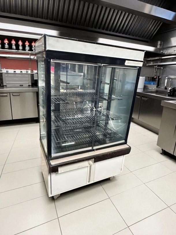 Hussmann DCB-243662 refrigerated merchandiser, 36" display case, pristine condition, 115V, fully tested and cooling.
