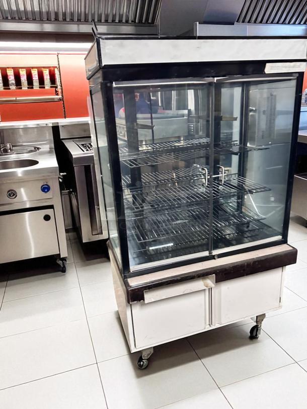 Pristine Hussmann DCB-243662 refrigerated merchandiser, 36" display case, 115V, glass doors, fully tested, excellent condition.