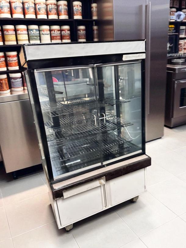 Hussmann DCB-243662 refrigerated merchandiser, 36" display case in pristine condition, 115V, fully tested and cooling.