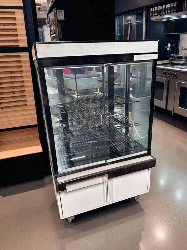 Pristine Hussmann DCB-243662 refrigerated merchandiser, 36" display, 115V, tested, cooling, glass doors, dual shelves, white finish.
