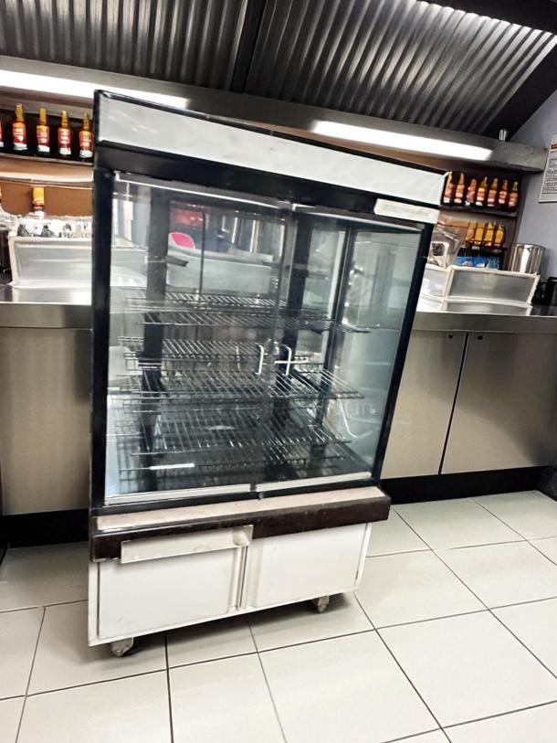 Hussmann DCB-243662 Refrigerated Merchandiser, pristine condition, 36" display case, 115V, fully tested and cooling.