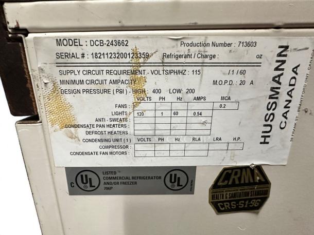 Hussmann DCB-243662 label showing model, serial number 1821123200123359, 115V details, and UL certification.