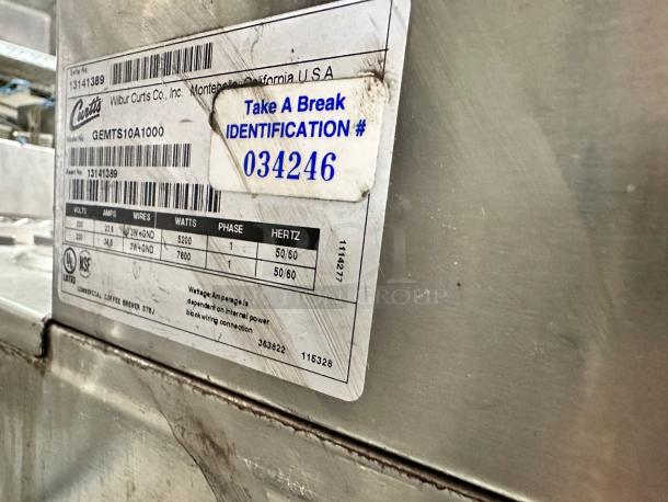 Curtis GEMTS10A1000 Twin Coffee Brewer with dual warming plates, superb condition, fully tested, 220V. Visible ID tag.