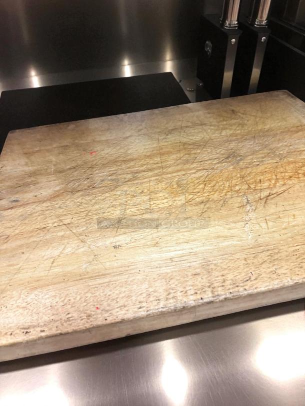 Heavy-duty wood butcher block cutting board, thick commercial grade, fully cleaned, showing signs of use, ready to use.