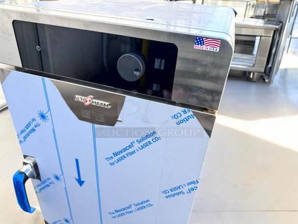 Brand new Alto-Shaam 1000-TH low-temp cook & hold oven, factory sealed. Visible USA-made sticker, protective wrapping intact.
