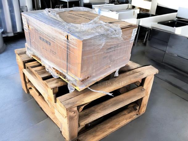 Brand-new American Range AERB-36 char broiler, factory sealed in box, on wooden pallet. Model details visible.