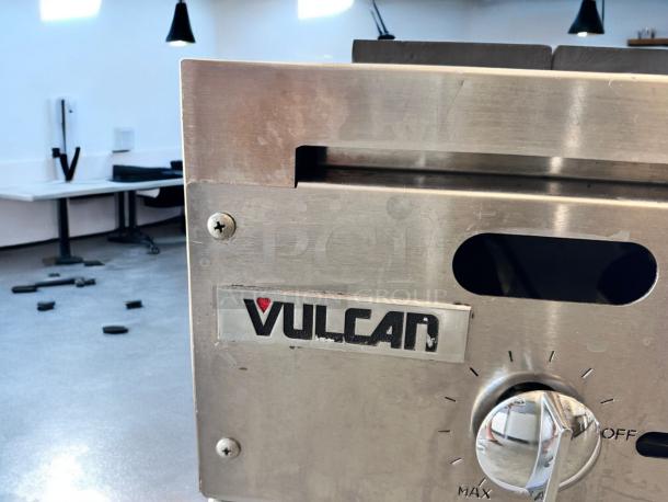Vulcan VCCB72 72" Gas Charbroiler, pristine condition, 6 burners, natural gas. Features Vulcan logo and control knob.
