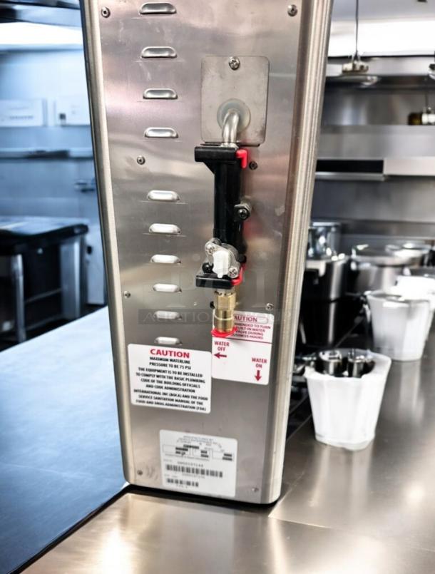 Flawless Newco FPM-1 Lemonade Dispenser with Ronnoco branding, stainless steel, brand new condition, caution label visible.