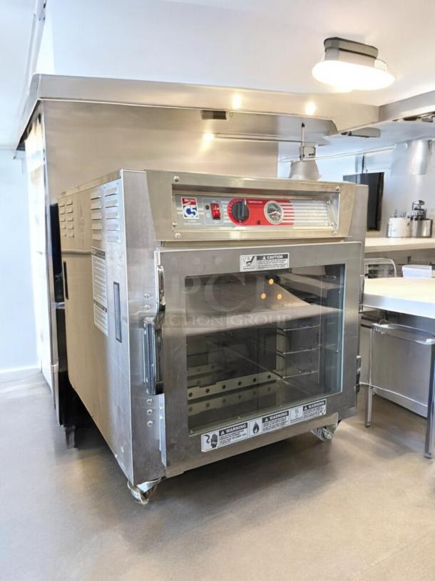 Flawless Metro C5 6-Series Heated Holding Cabinet, Model C563L-SFC-UA, full-view door, pristine condition, stainless steel.