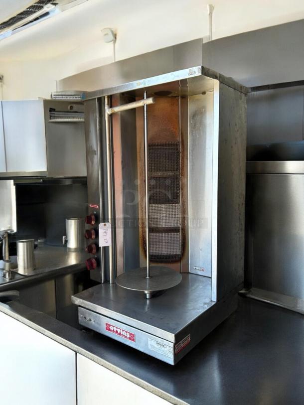 Attias S4Y-4 gas vertical broiler in exceptional condition, fully tested, made in USA. Features red control knobs, label, and tag.