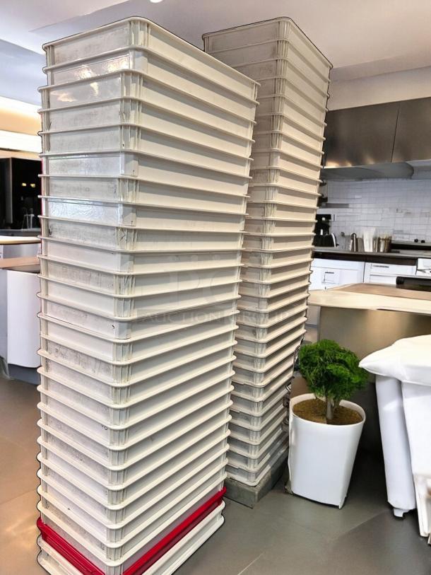 Stack of 50 white stackable commercial dough trays, high-density food-grade plastic, outstanding condition, fully cleaned.