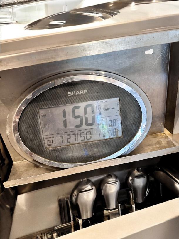 SHARP digital wall clock with thermo-hygrometer, stainless steel stand, LCD display showing time, temperature, and humidity, fully tested.