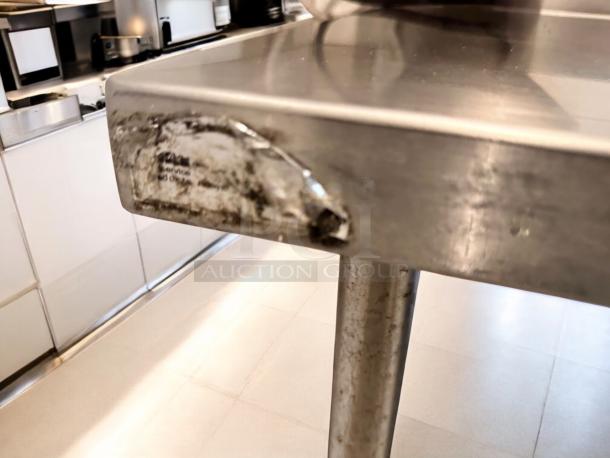 60" stainless steel work table with backsplash, heavy-duty, excellent condition. Custom CCommercial Fabrication model, fully tested.
