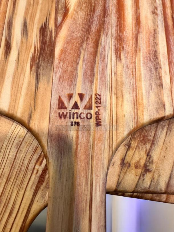 Like-new Winco WPP-1222 wooden pizza peels, natural finish, 22" blade, 12" handle, marked with model number, premium condition.