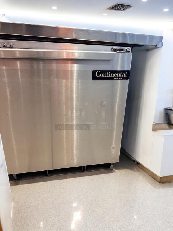 Continental undercounter refrigerator, 1 solid door, outstanding condition, stainless steel, tested, and fully working.