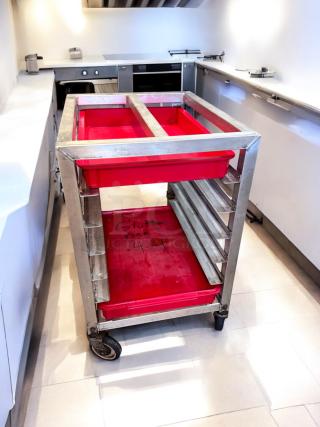 Alexander Industries aluminum pan rack, 20-tray capacity, model 44, NSF certified, excellent condition. Features red trays.