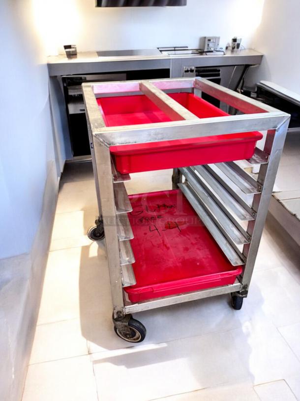 Alexander Industries aluminum pan rack, model 44, in excellent condition. NSF certified, 20-tray capacity, red trays, on casters.