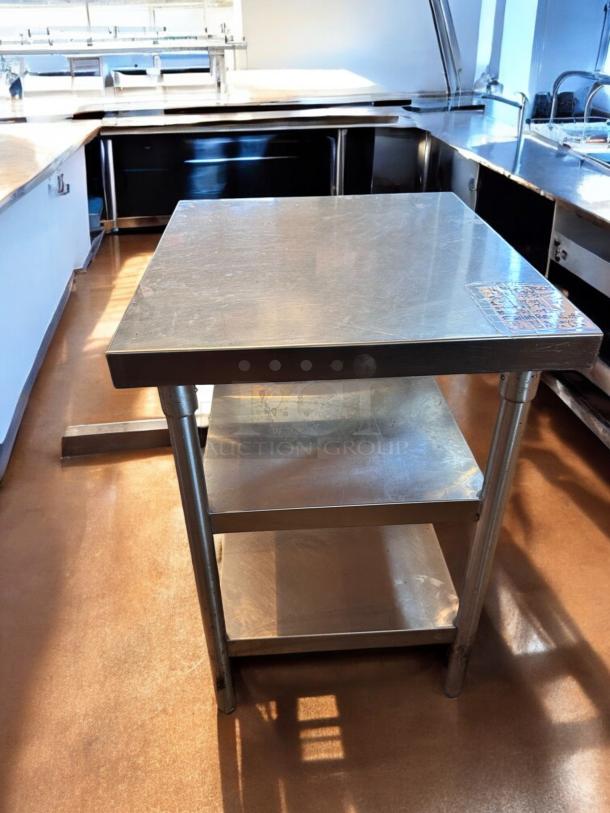 Like-new stainless steel work table with undershelf, 28"x28"x35". Heavy-duty, fully tested, commercial grade, clean condition.