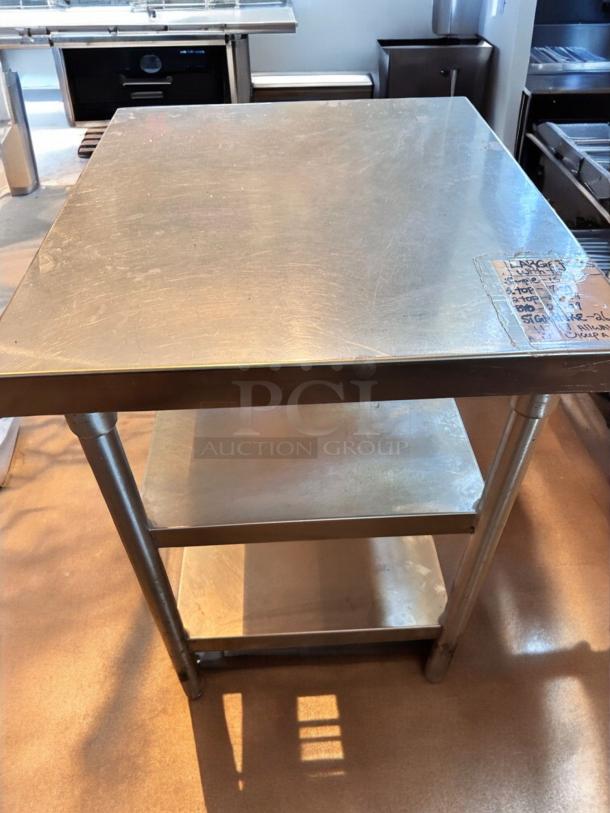 Stainless steel work table, 28"x28"x35", like-new condition with undershelf. Heavy-duty, commercial-grade. Fully tested and clean.