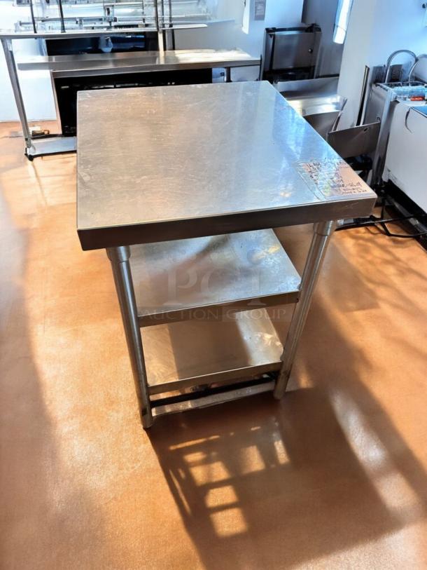Like-new stainless steel work table, 28" x 28" x 35", with undershelf. Heavy-duty, commercial grade, fully tested and clean.