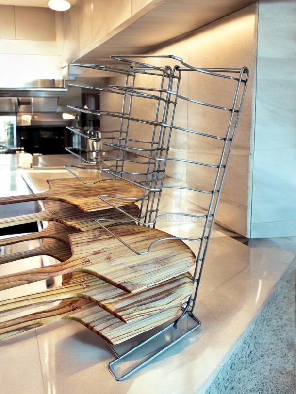 Chrome wire pizza peel rack with 8 wooden paddles, 11"D x 10"W x 28"H, heavy-duty, space-saving design, excellent condition.