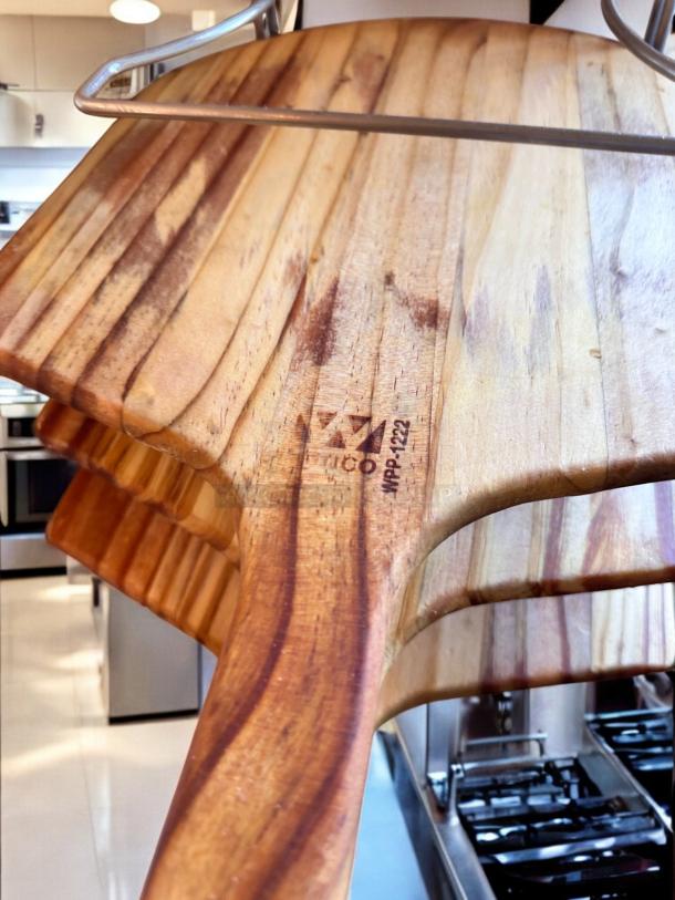 Chrome wire pizza peel rack with 8 wooden paddles, model WPP-1222. Excellent condition, space-saving design, 11"D x 10"W x 28"H.