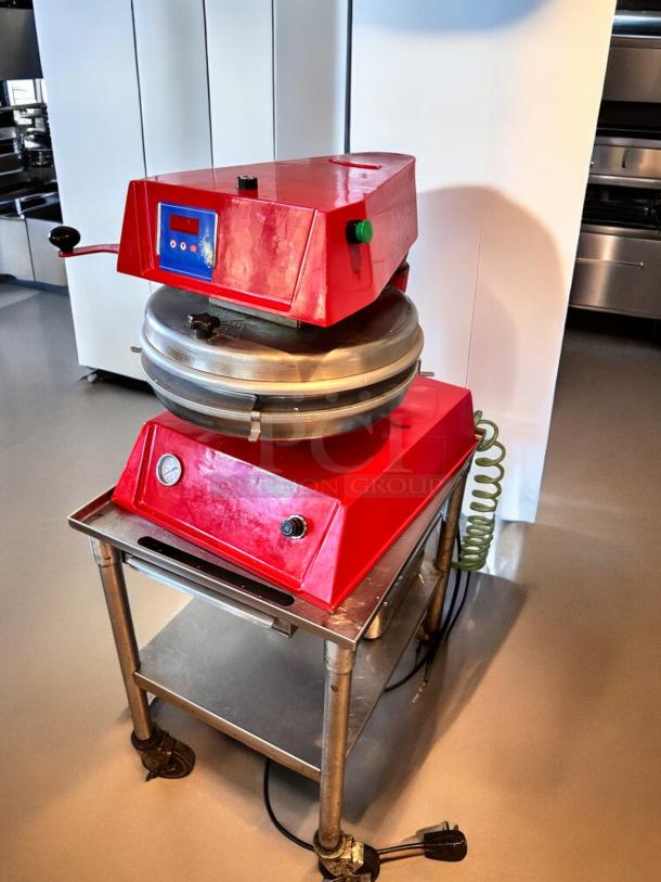 Proluxe DP2300 Pizza Dough Press in excellent condition, red casing, fully tested, 208V model, on a metal stand.