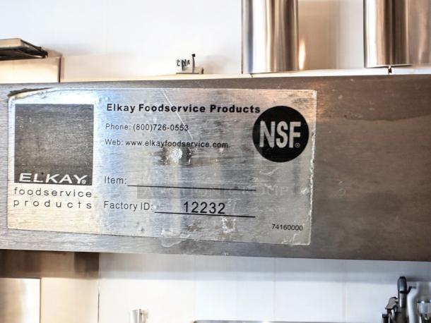 Elkay stainless steel wall shelf in outstanding condition, 72"W x 12"D, NSF certified, model 12232.