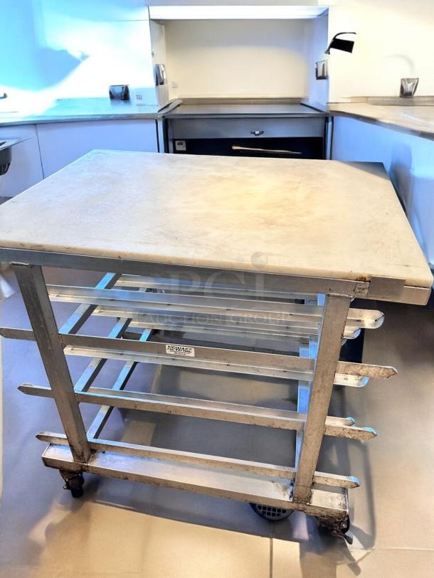 New Age Industrial can storage prep table cart with aluminum frame and poly top. Custom NSF model, superb condition, fully tested.