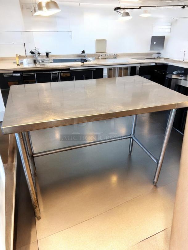 Like-new stainless steel work table, 48"x30"x36", heavy-duty commercial prep, fully tested, Custom Commercial model.