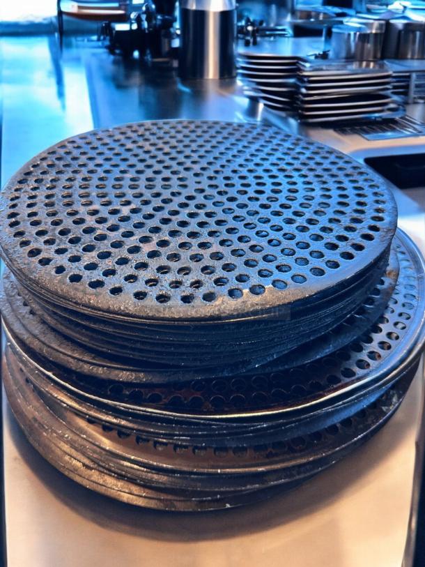 17 pre-seasoned perforated pizza disks, 14" diameter, heavy-duty, superb condition, clean and ready for use.