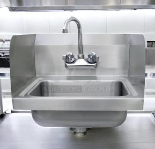 Immaculate Advance Tabco stainless steel hand sink with faucet, side splashes, wall-mount design; fully tested, excellent condition.