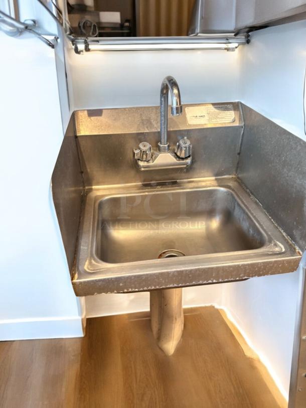 Advance Tabco stainless steel hand sink with faucet, side splashes, wall mount; immaculate condition, fully tested.