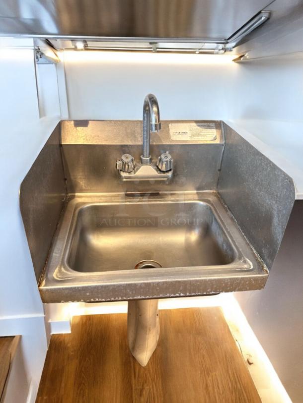 Immaculate Advance Tabco stainless steel hand sink with faucet, side splashes, wall mount, fully tested, excellent condition.