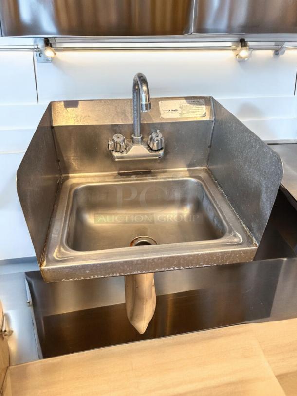 Immaculate Advance Tabco stainless steel hand sink with faucet, side splashes, wall-mounted. Fully tested and working.