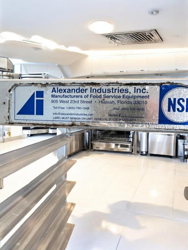 Alexander Industries aluminum sheet pan rack, outstanding condition, 20 pan capacity, fully tested and working, manufacturer label visible.