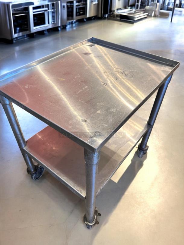 Stainless steel utility prep cart, 23"x18"x34.5", on casters, top-tier condition, fully tested and working.