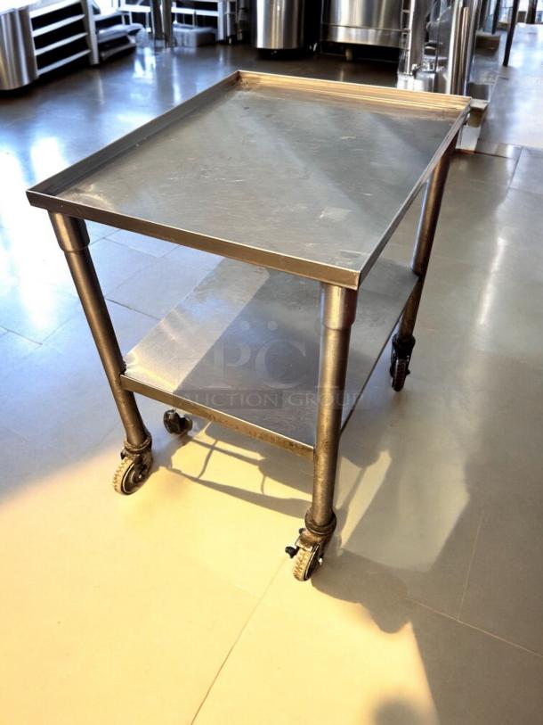 Stainless steel utility prep cart, 23"x18"x34.5", on casters, top-tier condition, fully tested, includes bottom shelf.