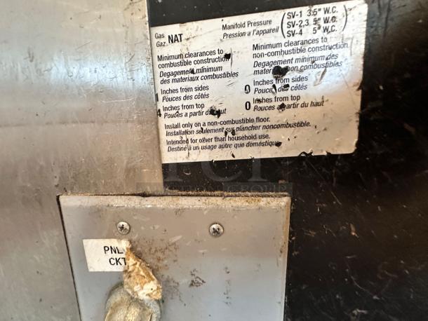 Alt text: Wood Stone Mt. Adams 9660 pizza oven with visible label showing natural gas specs and clearances. Excellent condition.