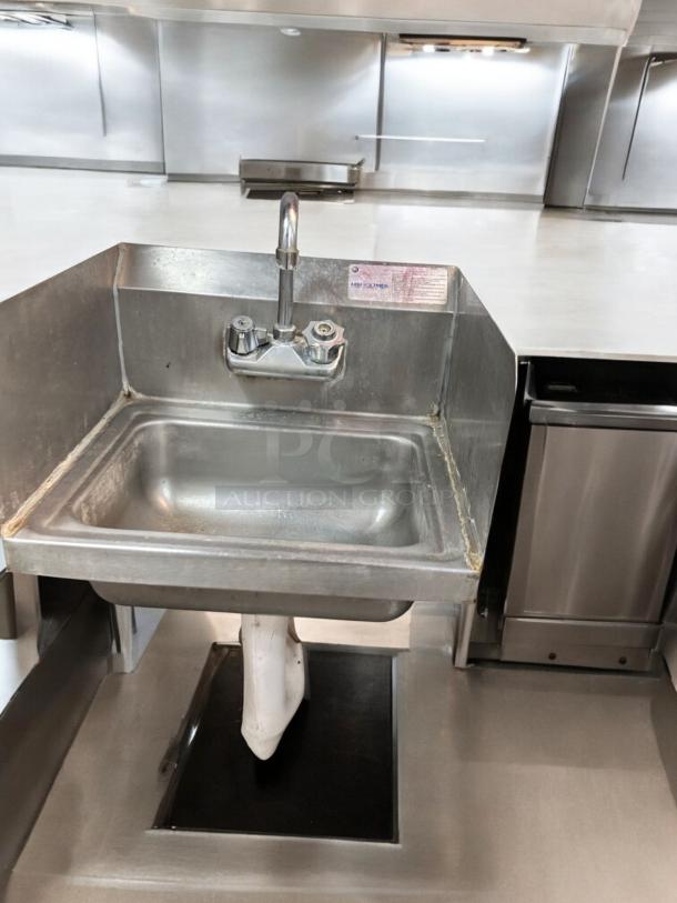 Advance Tabco WS-1 hand sink, wall-mounted, excellent condition, with faucet, side splashes, and label indicating full functionality.