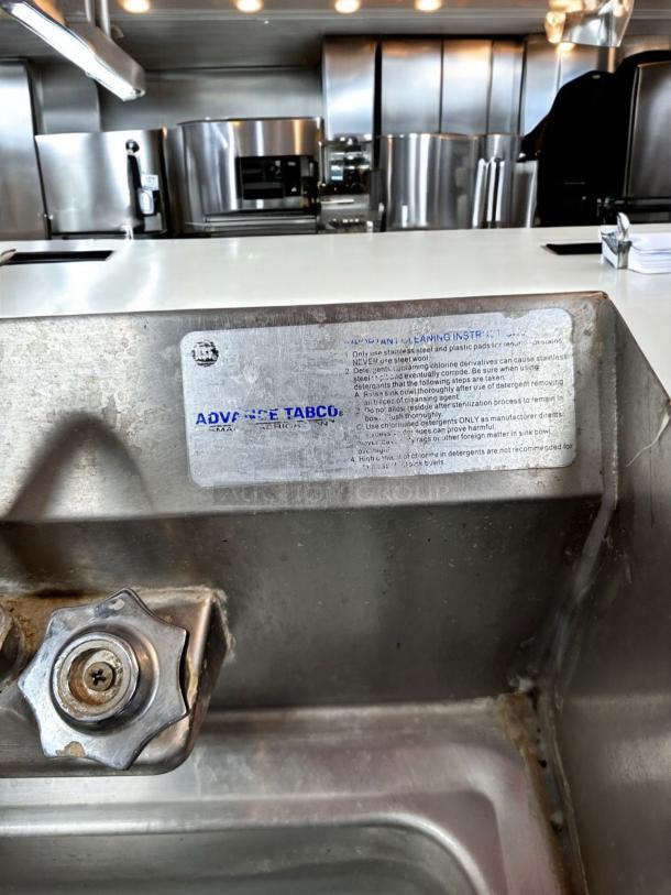 Advance Tabco WS-1 wall-mount hand sink with faucet and side splashes. Stainless steel, outstanding condition, visible label.