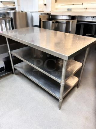 Heavy-duty stainless steel prep table with two undershelves. Outstanding condition, fully tested and working.