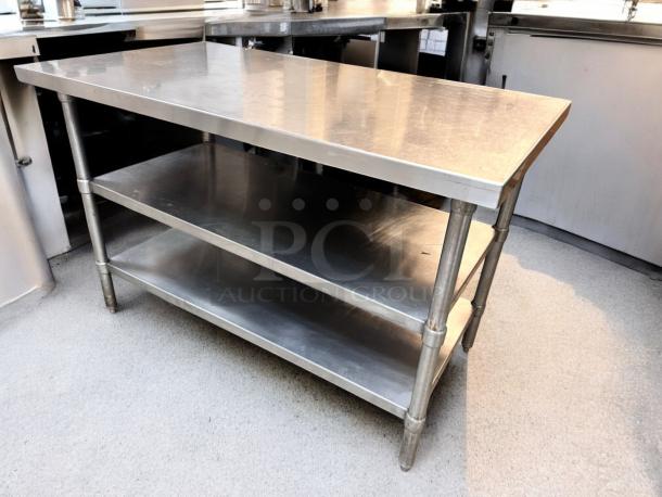 Heavy-duty stainless steel prep table with two undershelves in outstanding condition, fully tested and working.
