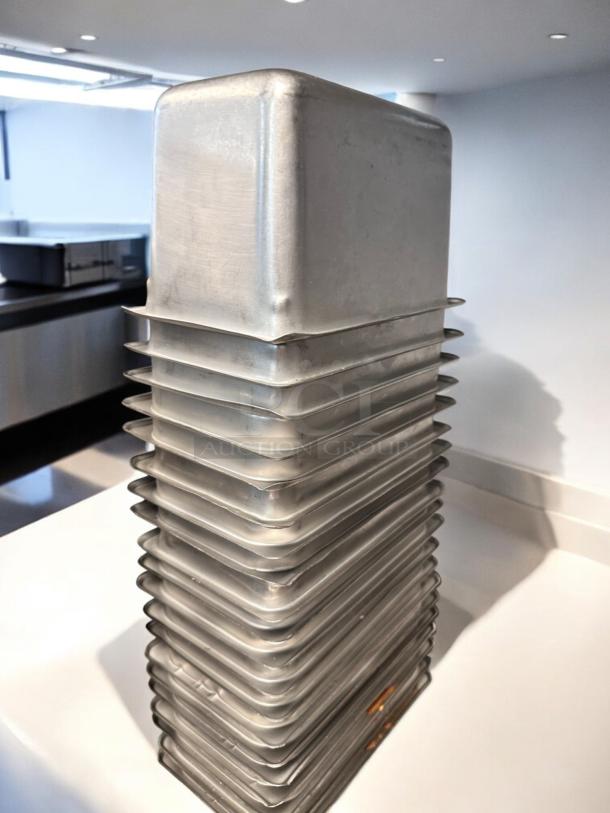 Stack of used commercial aluminum loaf pans in superb condition. Includes multiple pans, ready for service. Model: Commercial Standard.