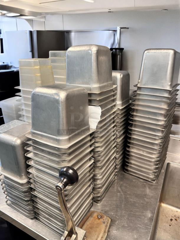 Used aluminum commercial loaf pan set, superb condition, multiple stacks, ready for service, durable and ideal for bakeries.